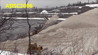 CAT D8 Bulldozer Working Snow Dump Hill