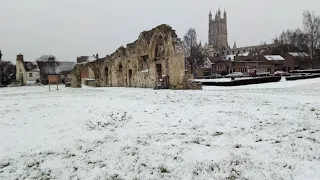 Gloucester in snow, St Oswald's Priory and Cathedral shown.