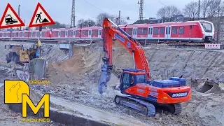 Let the powerful crawler excavator demolish the old train platform! Doosan 50 ton & dump truck