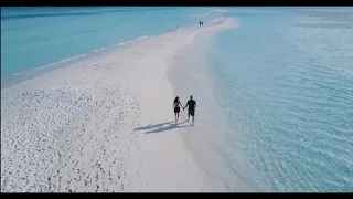 Romantic Couple Walking Drone Shot on Sunny Beach