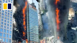 Massive fire engulfs office building in China