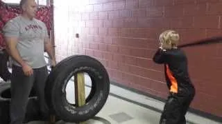 10 year old demonstrates 36 oz. heavy bat swings on tire