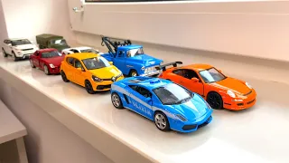 Diecast Cars Driving By Hand On Windowsill