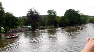 Steve Redgrave and crew row Olympic Flame along the Thames at Henley