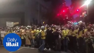 Demonstrators form human shield around protesters in Portland