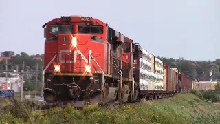 Three Engines Lead a Long manifest Train CN 507 Out of Amherst, NS