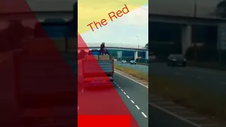 Watch this amazing video where a man drives his red Ferrari under an 18 wheeler. #shorts