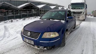 VW Passat 2.8 4-Motion pulls a truck on snow