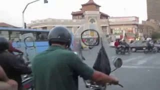 Driving in Teheran on a motorcycle taxi