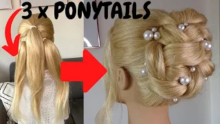 The EASIEST knotted high bun hairstyle - how to do a high curly bun