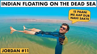 INDIAN FLOATING ON THE DEAD SEA, JORDAN