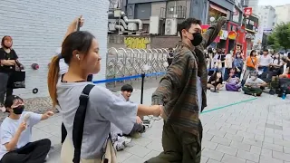 THURSDAY. CHOREOGRAPHER'S EXHILARATING IMPROMPTU INTERACTIVE BUSKING WITH ONLOOKER. HONGDAE STREET.