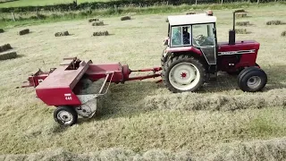 International 784 & International 440 baler assisted by a Ford 2000 creating the rows. .