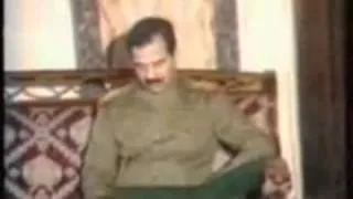 Donald Rumsfeld shaking hands with Saddam Hussein