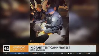 Protesters block driveway of migrant tent camp construction site