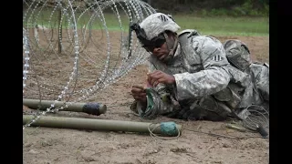 US Marines train how to use improvised Bangalore torpedoes to demolish and breach an obstacle