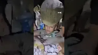 A Palestinian child is found alive under rubble in Gaza, still in his bed