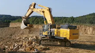 Komatsu PC1250 loading HD605 and breaking blocks