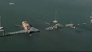 Crews open temporary channel near Baltimore bridge collapse for essential vessels