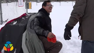 Homeless man sleeps out in the snow at -18°C