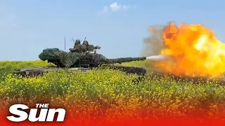 Russian T-80 tank crews fire at Ukrainain forces on the battlefield