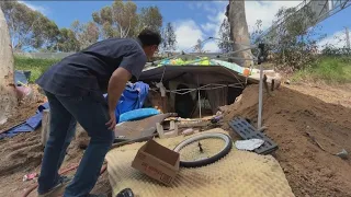 Shelter carved into side of freeway causing concern