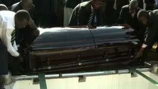 Industrialist James Mulwana is buried