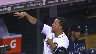 Miggy throws a pass to Megatron from dugout