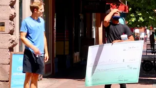 Giving Giant Checks to Strangers