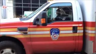 FDNY EMS AMBULANCE, STUCK IN TRAFFIC, RESPONDING & GIVES ME A WAVE ON W. 41ST ST. IN HELLS KITCHEN.