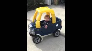 Jack driving his little tikes truck