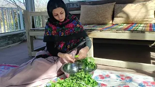 Cooking "ASH-e DUOGH" on firewood in nature