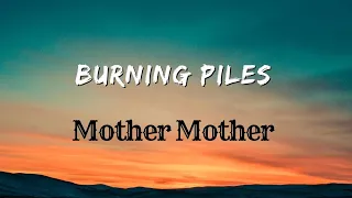 It Goes, All My Troubles On A Burning Pile ( Buring Piles ) - Lyrics | Mother Mother