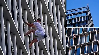 Free-climber scales London skyscraper to raise awareness of climate change