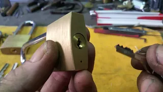 #117 Plug retainer removal on small brass padlocks.