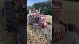 Massey Ferguson tractor and a John Deere baler