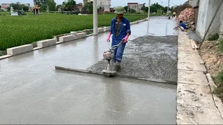 Construction Project Of A Concrete Road Stretching Across A Rural Field With Ready-Mixed Concrete