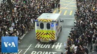 Hong Kong Protesters Block Road, Make Way for Ambulance