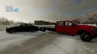 pulling out stuck cars in a (blizzard)!!! farming simulator 22