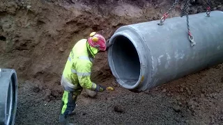 Excavator Laying Concrete Drain Pipes, The Whole Experience!