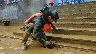 China's Army Day: Troops fight against devastating floods