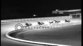 Pacers compete in harness race on Yonkers Raceway, New York, at end of 1958 seaso...HD Stock Footage