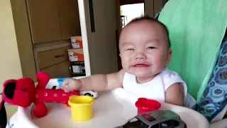 cute baby laughing hysterically