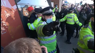 Scuffles and arrests at anti-lockdown protest in Clapham, London.