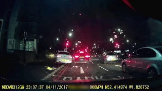 Car mounts pavement to jump red light