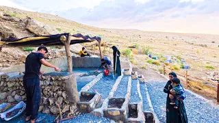 "Amir and his family are cementing the floor of the black room of the tent: family bonding project"