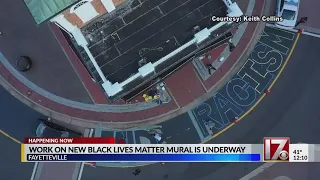 Work on new Fayetteville Black Lives Matter mural underway