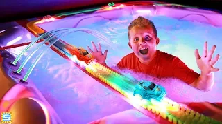 Longest Giant Magic Tracks Toy Car Chase Over Hot Tub!