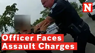 Watch: Policeman Faces Assault Charges After Grabbing Officer By Throat