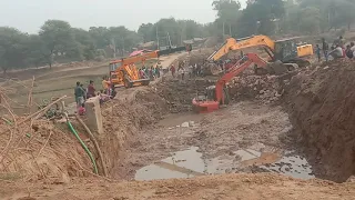 Tata Hitachi 120 excavator stuck in mud